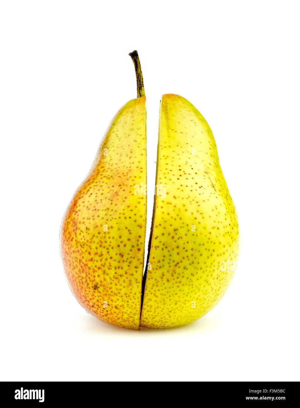 Vertical shot of colorful corella pear halves perfectly cut Stock Photo