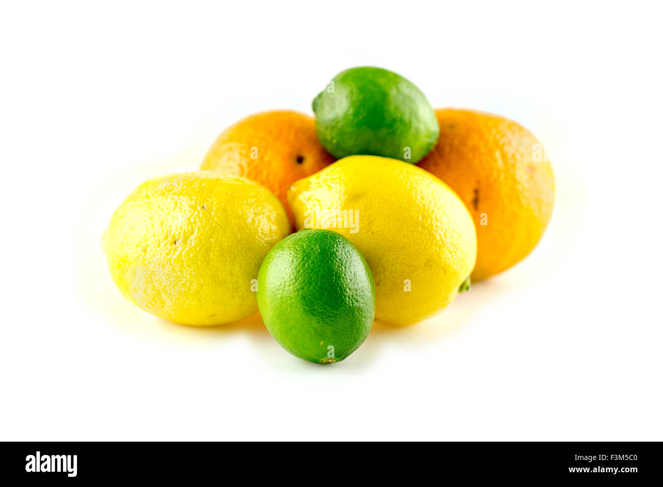 Pile of tasty citrus fruits with oranges lemons and limes Stock Photo