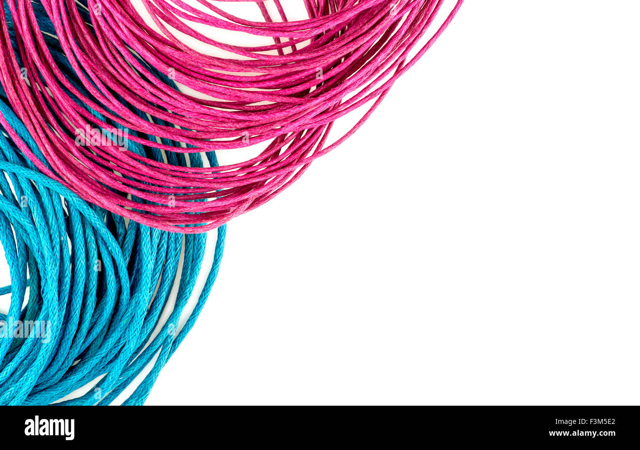 Vibrant blue and pink string rope with white copyspace Stock Photo