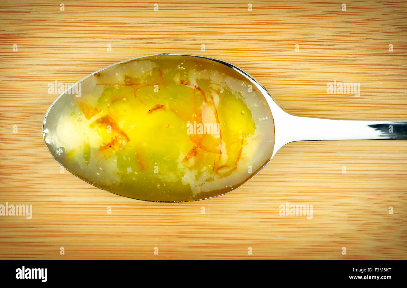 Spoon of delicious orange jam Stock Photo