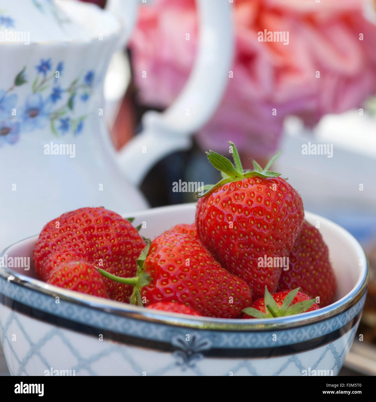 Strawberries in bowl, part of cream tea Stock Photo Alamy