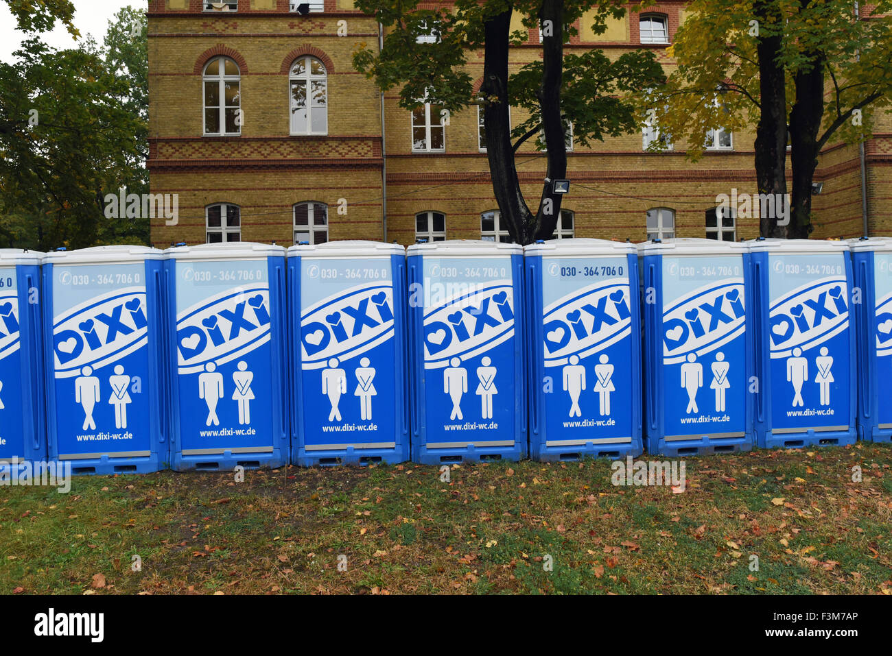 Mobile toilet facilities on the grounds of a refugee processing centre in the public authorities headquaters in Potsdam, Germany, 9 October 2015. The German state of Brandenburg will be accepting more than 40,000 refugees after the orders of the Interior Minister. Photo: RALF HIRSCHBERGER/ZB Stock Photo