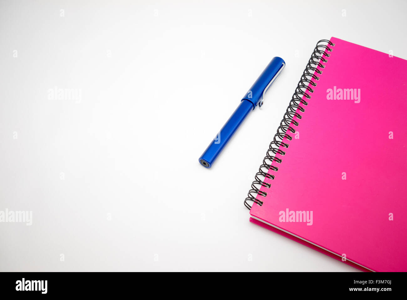 Notebook and pen isolated on white background Stock Photo - Alamy