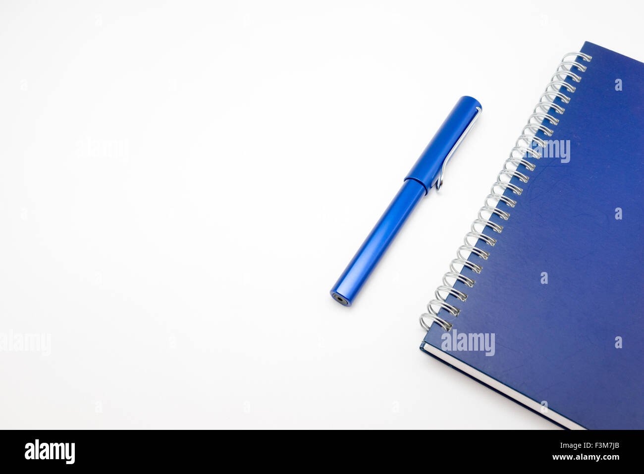Notebook and pen isolated on white background Stock Photo - Alamy