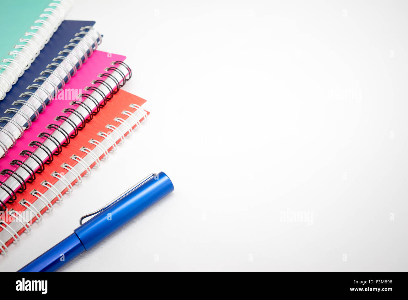Notebook and pen isolated on white background Stock Photo - Alamy