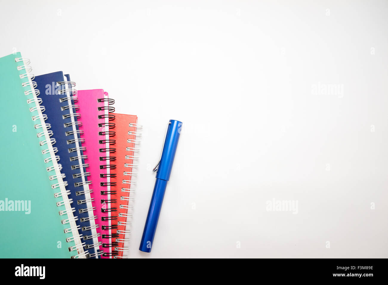 Notebook and pen isolated on white background Stock Photo - Alamy