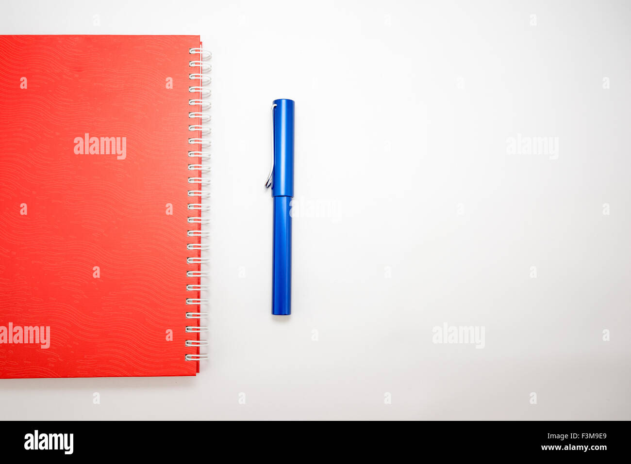 Notebook and pen isolated on white background Stock Photo - Alamy
