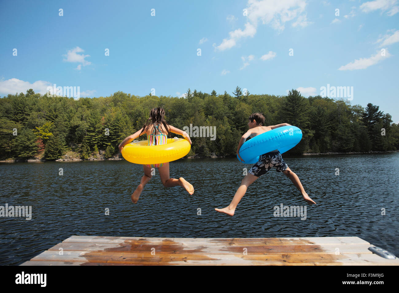 Inflatable,Teenage Girl,Boy,Lake,Rubber Ring Stock Photo