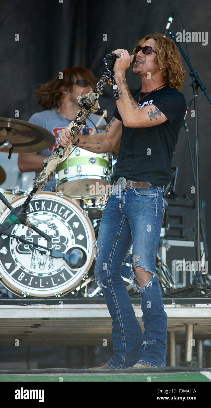 Manhattan, Kansas  6-28-2015 Noll Billings of Blackjack Billy performs at the Kicker Country Stampede in Manhattan, Kansas. Blackjack Billy is an American country rock group composed of Rob Blackledge (vocals, bass guitar), Noll Billings (vocals), Jeff Coplan (electric guitar), and Brad Cummings (drums). Based in Nashville, they describe their music as 'Redneck Rock.'  Their debut single, 'The Booze Cruise,' was independently released in March 2013. Stock Photo