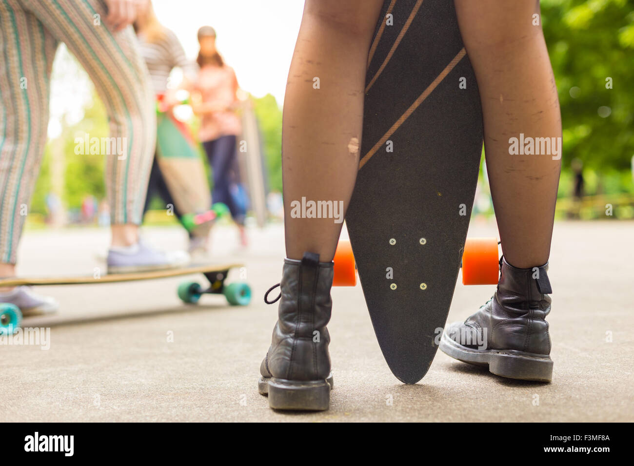 Teenage girl urban long board riding Stock Photo - Alamy
