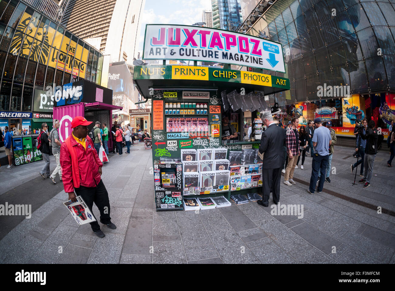 New York, NY, USA. 09th Oct, 2015. The 'T. SQ Newsstand' is debuted in Times Square in New York on Friday, October 9, 2015. Created by the artist Kimou 'Grotesk' Meyer with Victory Journal and Juxtapoz Magazine, the pop-up displays and sells art and culture zines created by a litany of artists. It will be in business at the crossroads of the world until October 18. Credit:  Richard Levine/Alamy Live News Stock Photo