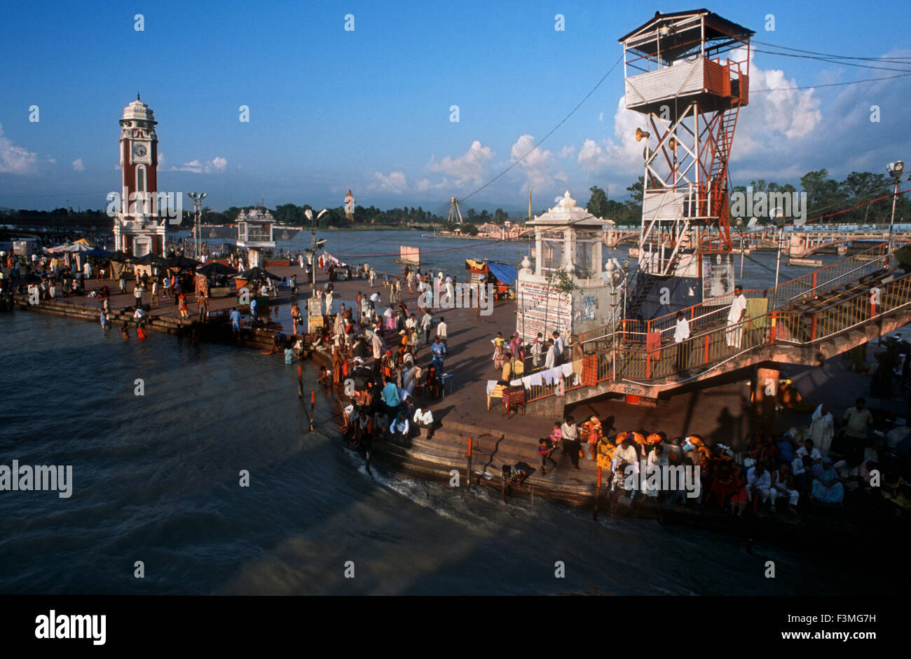 People bathing and making puja on Ganga Ghat in Haridwar in India. Haridwar, Uttaranchal, India, One of the most famous and most Stock Photo