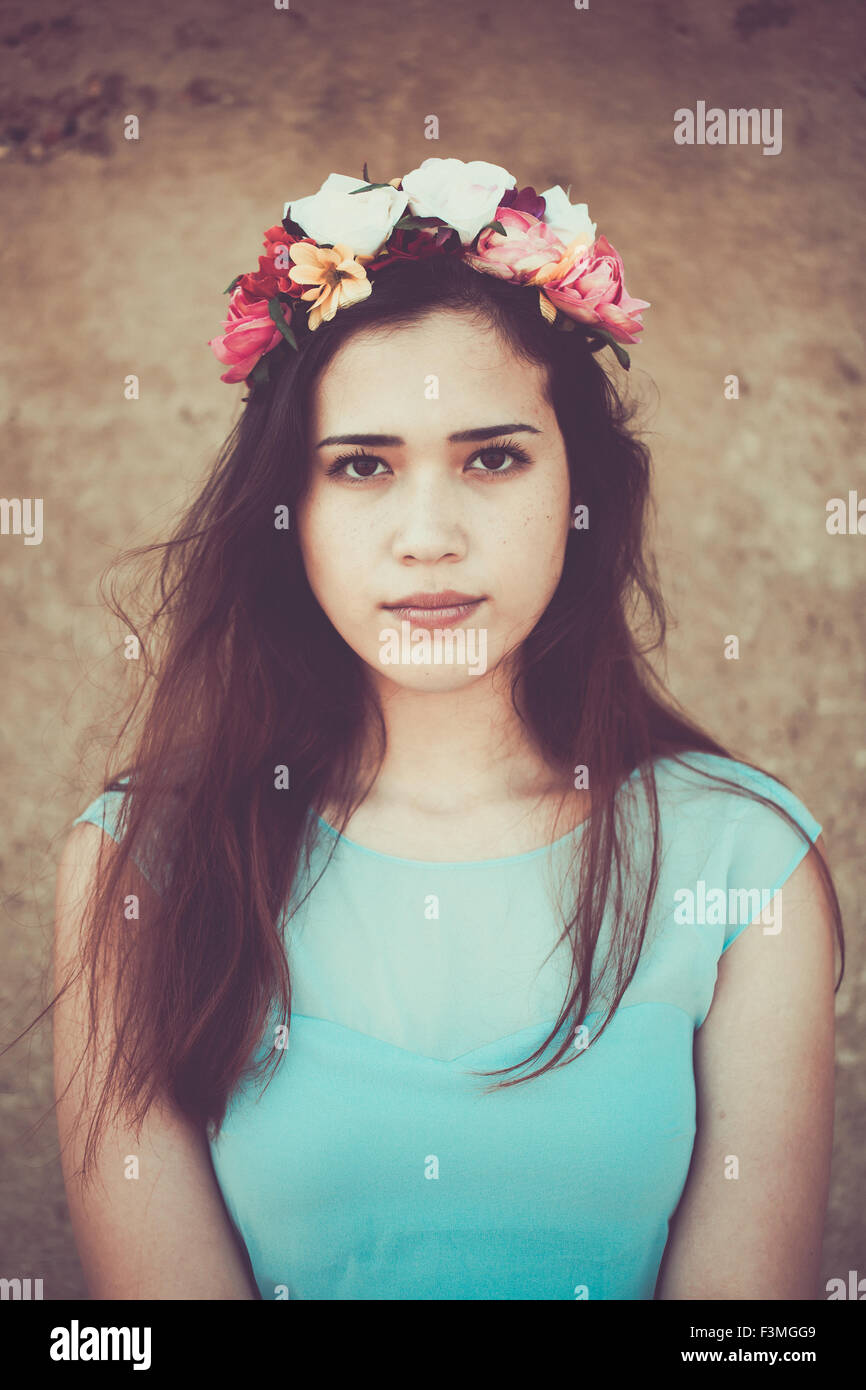 Beautiful young woman wearing a flower crown Stock Photo Alamy