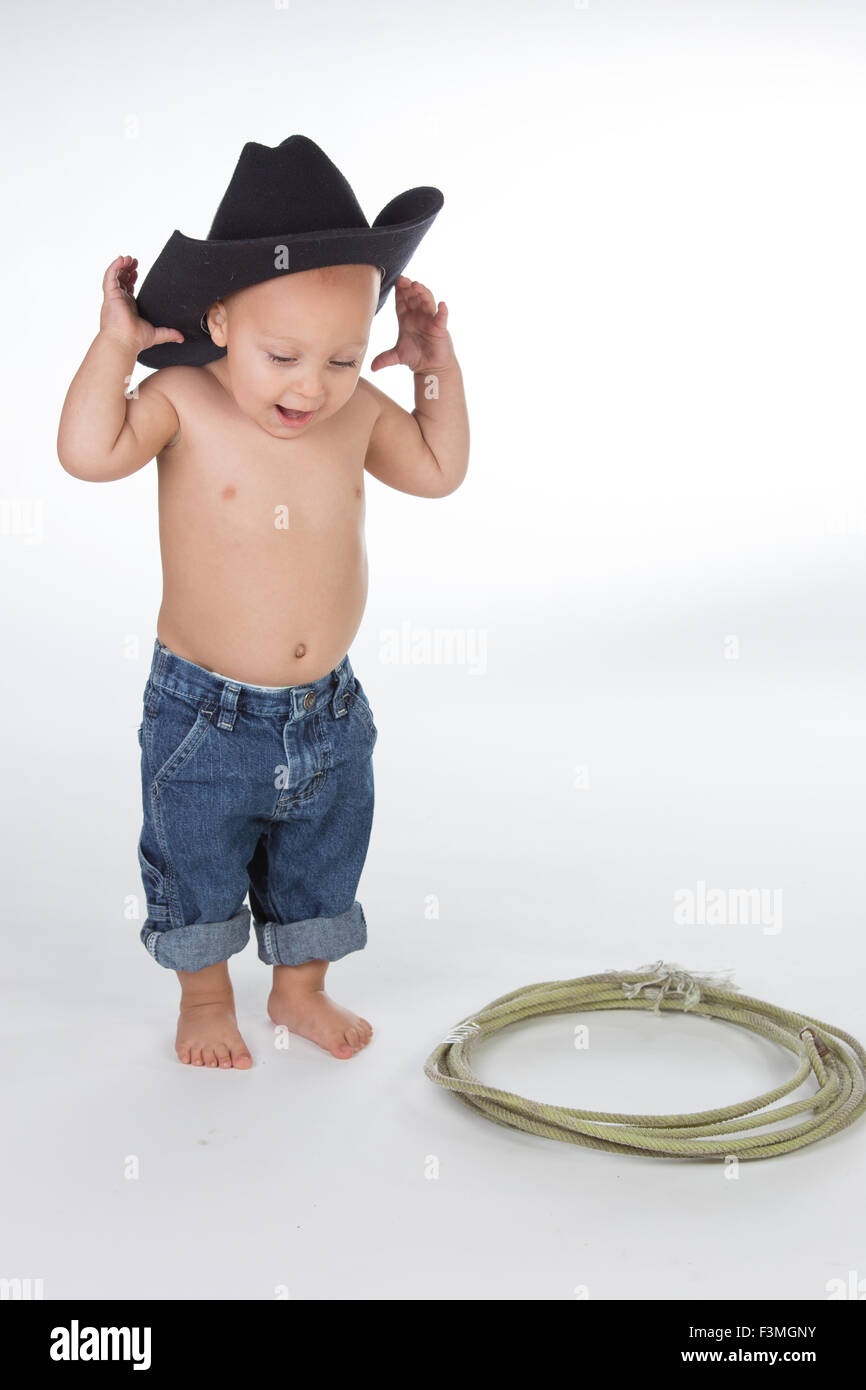 Baby boy dressed as cowboy posing in studio Stock Photo Alamy