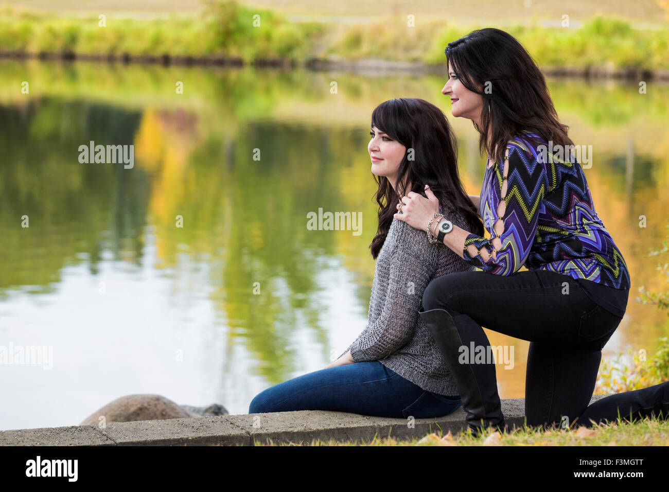 Mother,Bonding,Daughter,Lake,Smiling Stock Photo