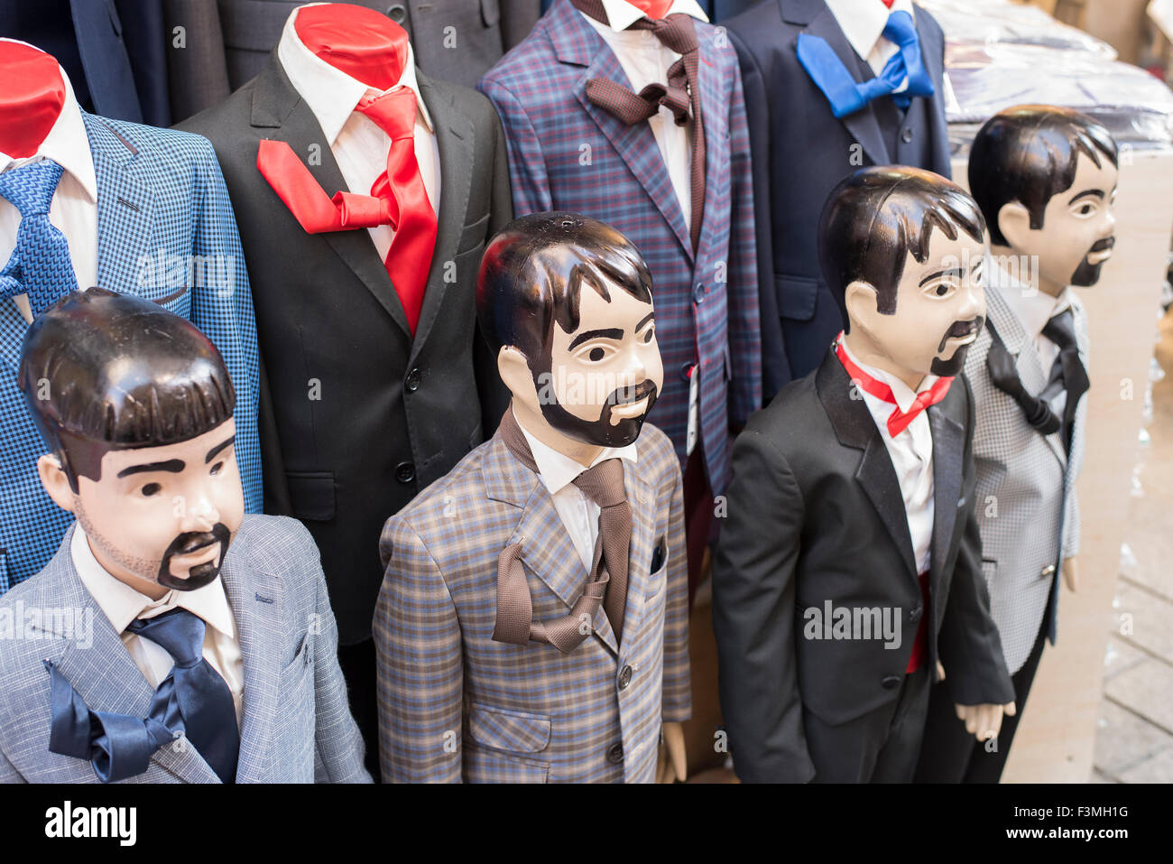 Small child size mannequins with beards and mustaches outside shop in Istanbul, Turkey. Stock Photo