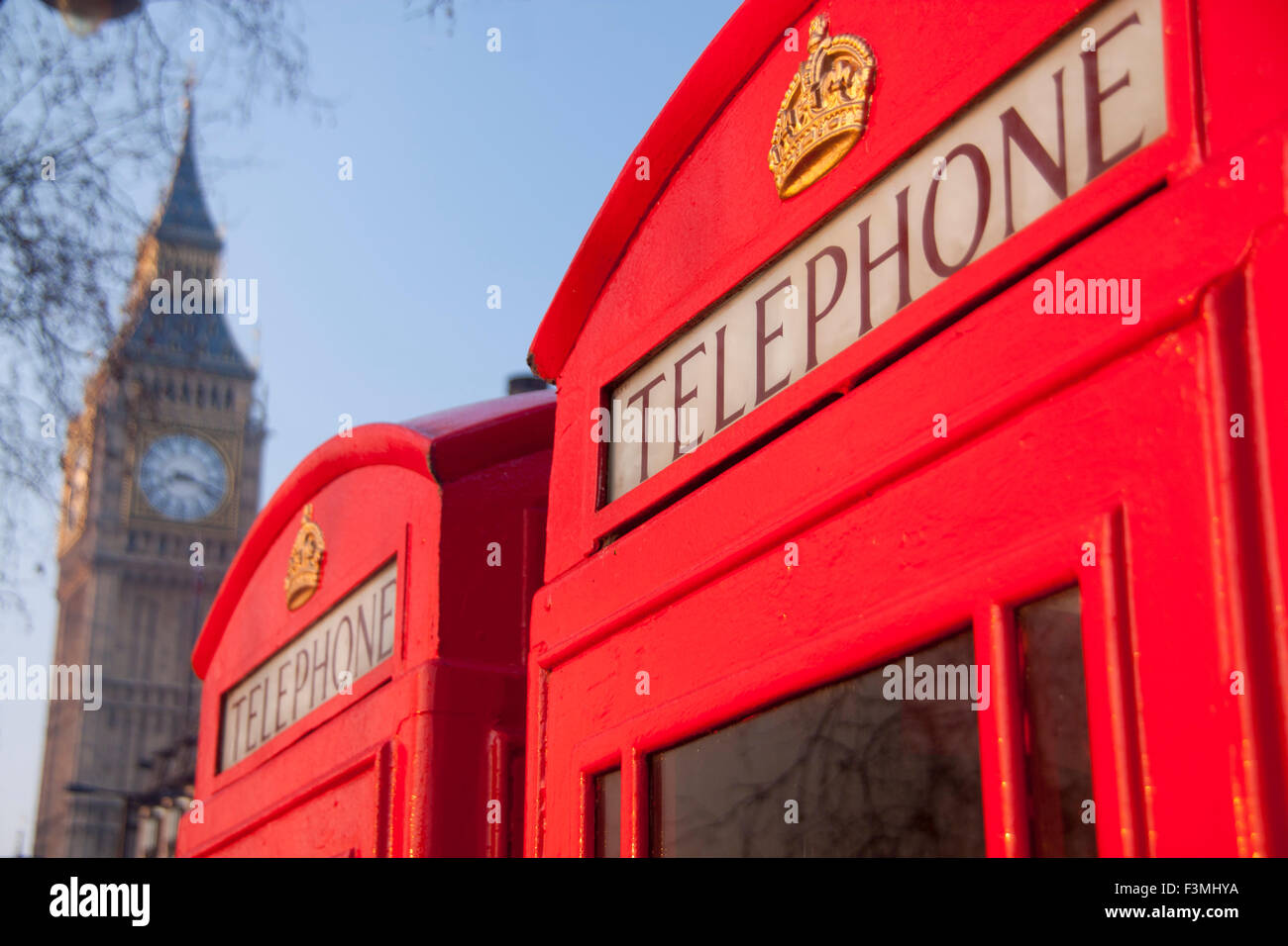 Big Ben Elizabeth Tower Clock Tower of Houses of Parliament with two traditional red K6 telephone  phone boxes in foreground Vic Stock Photo