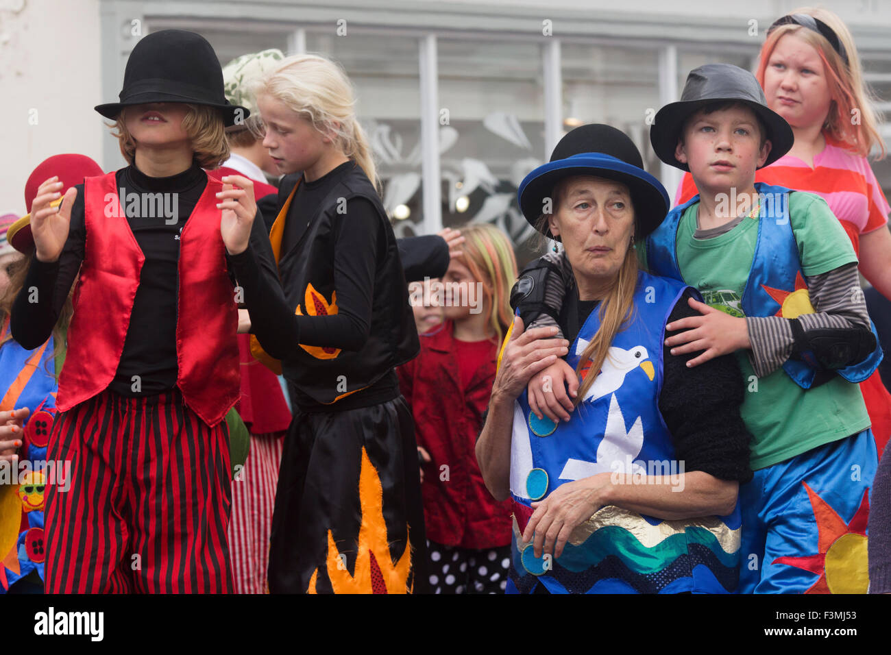 Falmouth, UK. Friday the 9th of October 2015. Local Schools parade through Arwenack street in Falmouth in colourful costumes for the start of the Falmouth Oyster Festival 2015. Credit:  Michael Hirst/Alamy Live News Stock Photo
