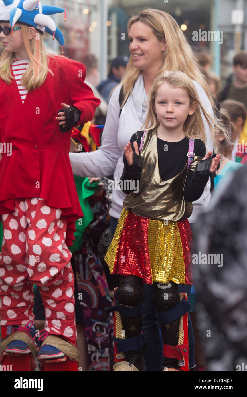 Falmouth, UK. Friday the 9th of October 2015. Local Schools parade through Arwenack street in Falmouth in colourful costumes for the start of the Falmouth Oyster Festival 2015. Credit:  Michael Hirst/Alamy Live News Stock Photo