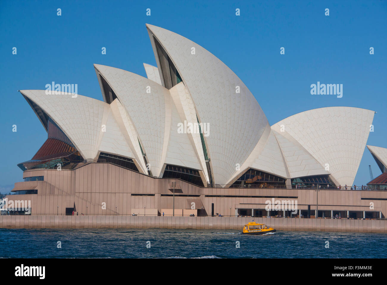 Water taxi passing Sydney Opera House Sydney Harbour Sydney New South Wales NSW Australia Stock Photo