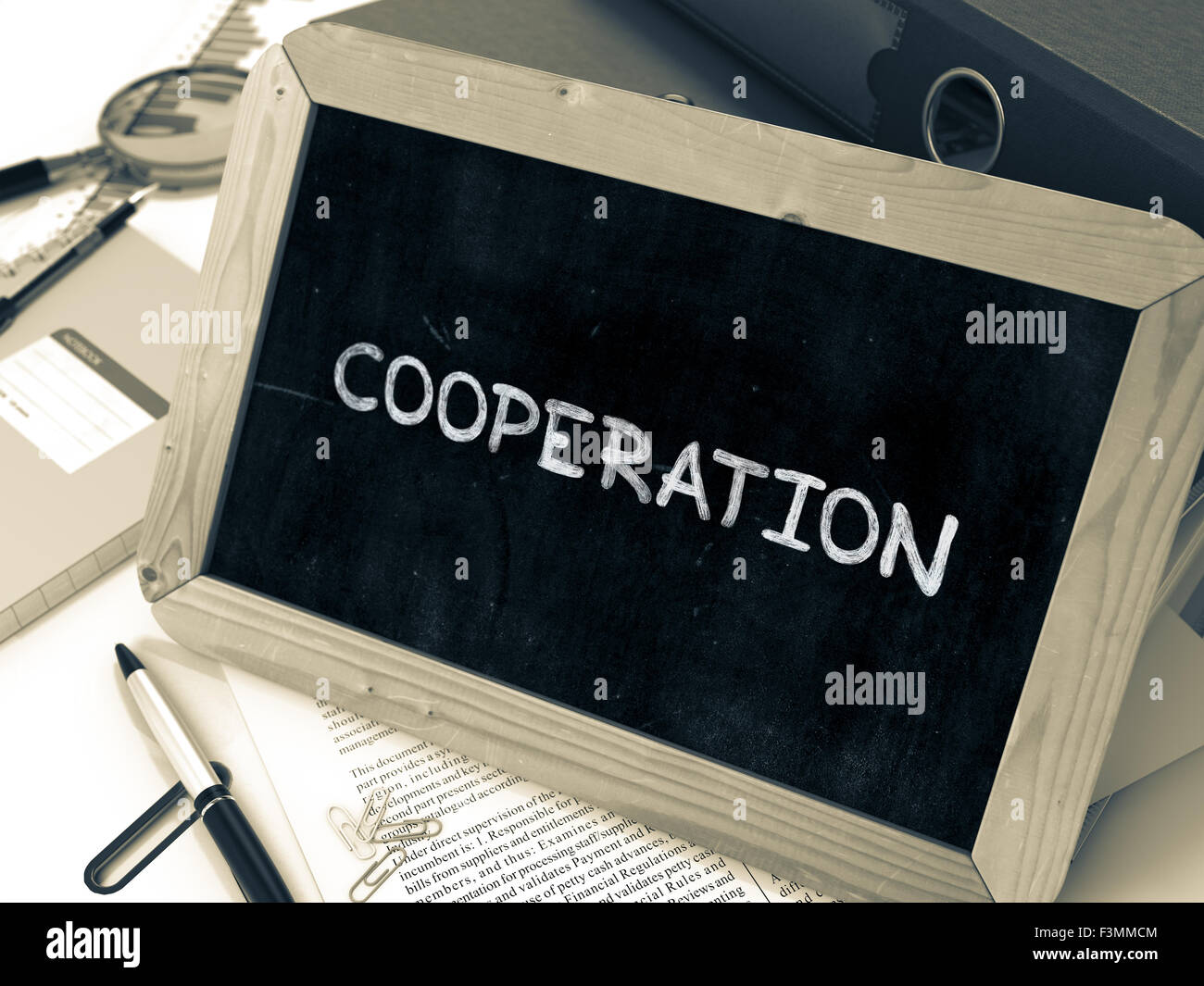 Cooperation - Chalkboard with Hand Drawn Text Stock Photo - Alamy