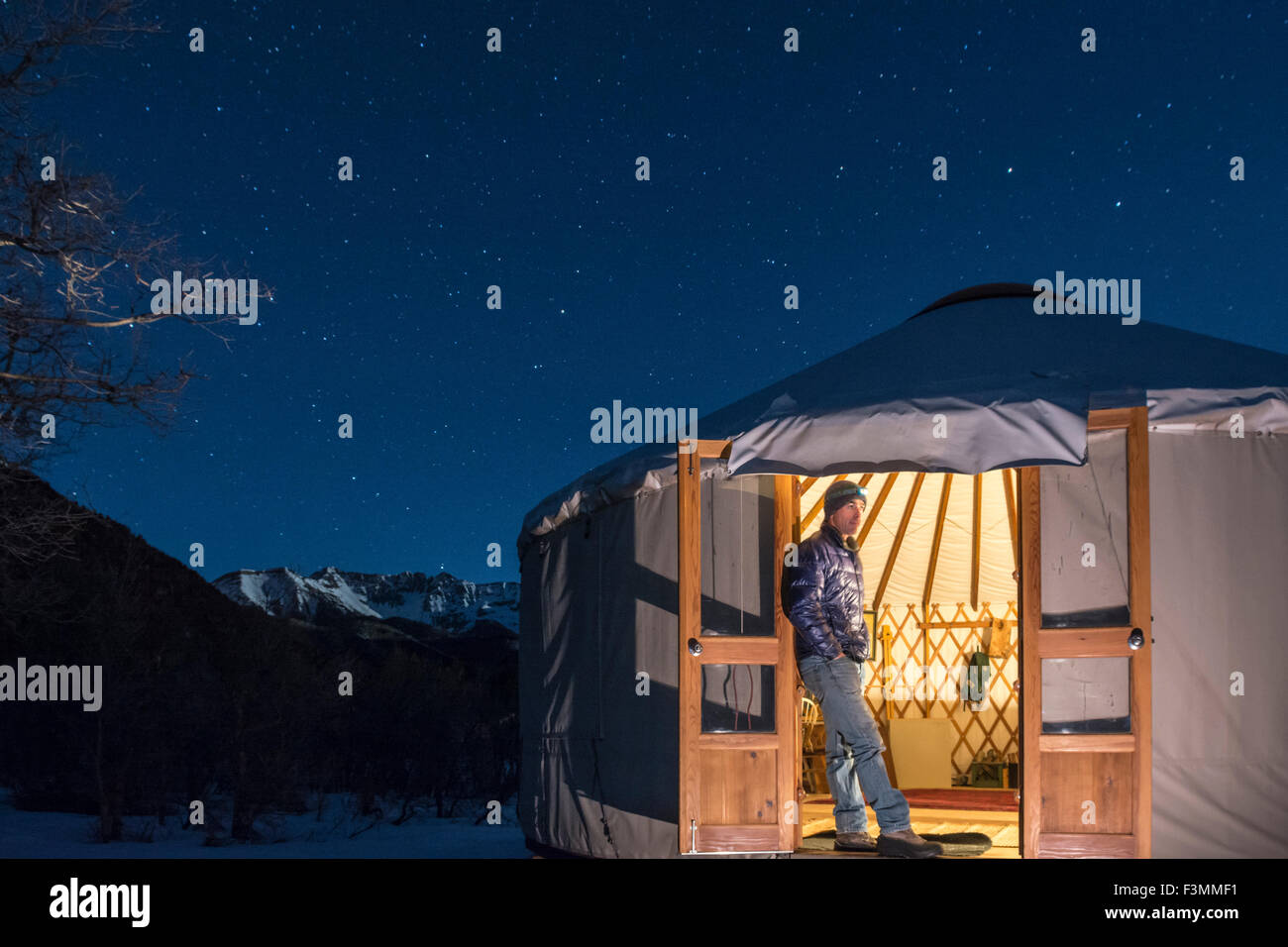 A man watching in  a yurt, Mayday, Colorado. Stock Photo
