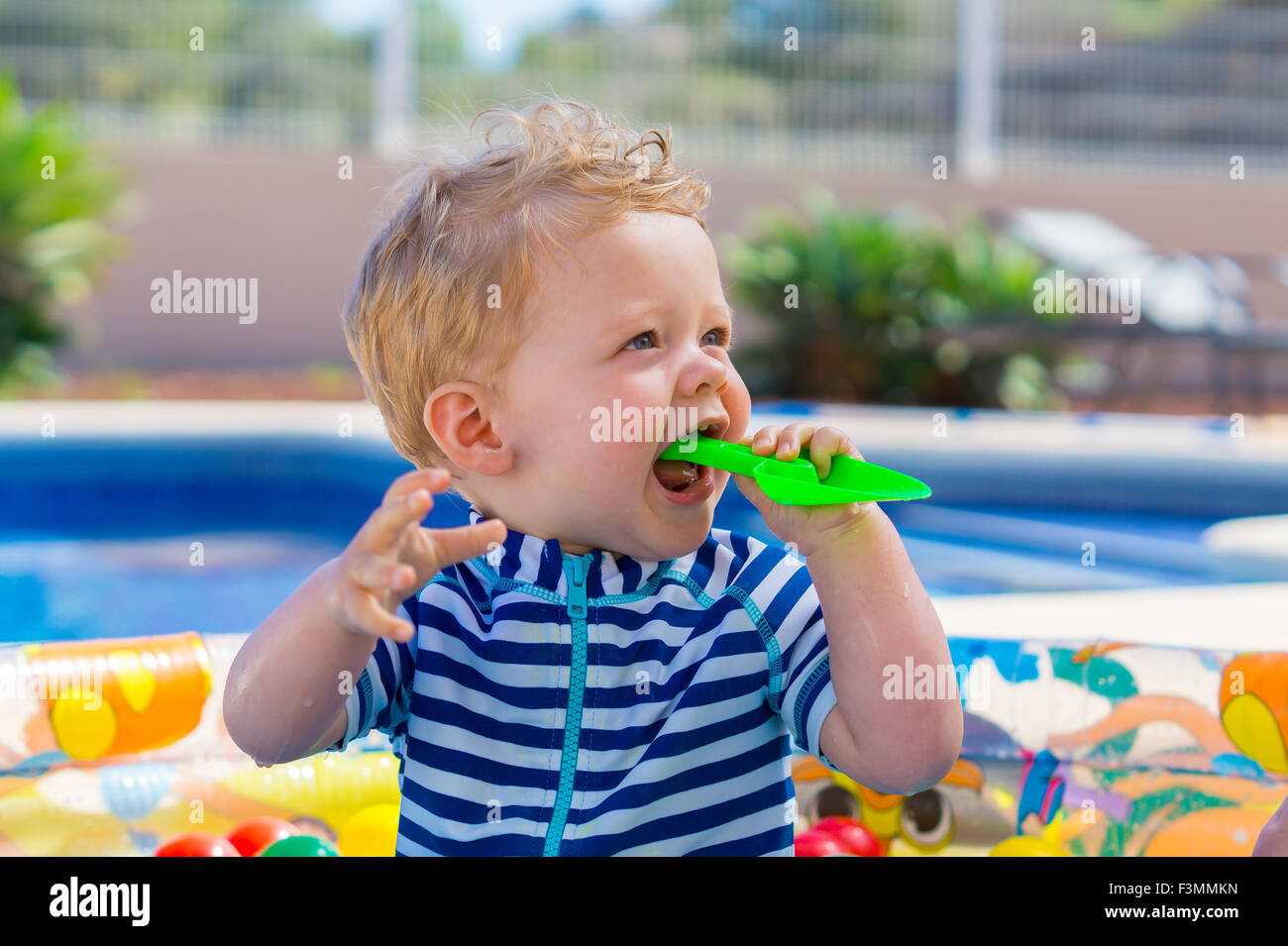 Cute baby boy in paddling pool on holiday Stock Photo Alamy