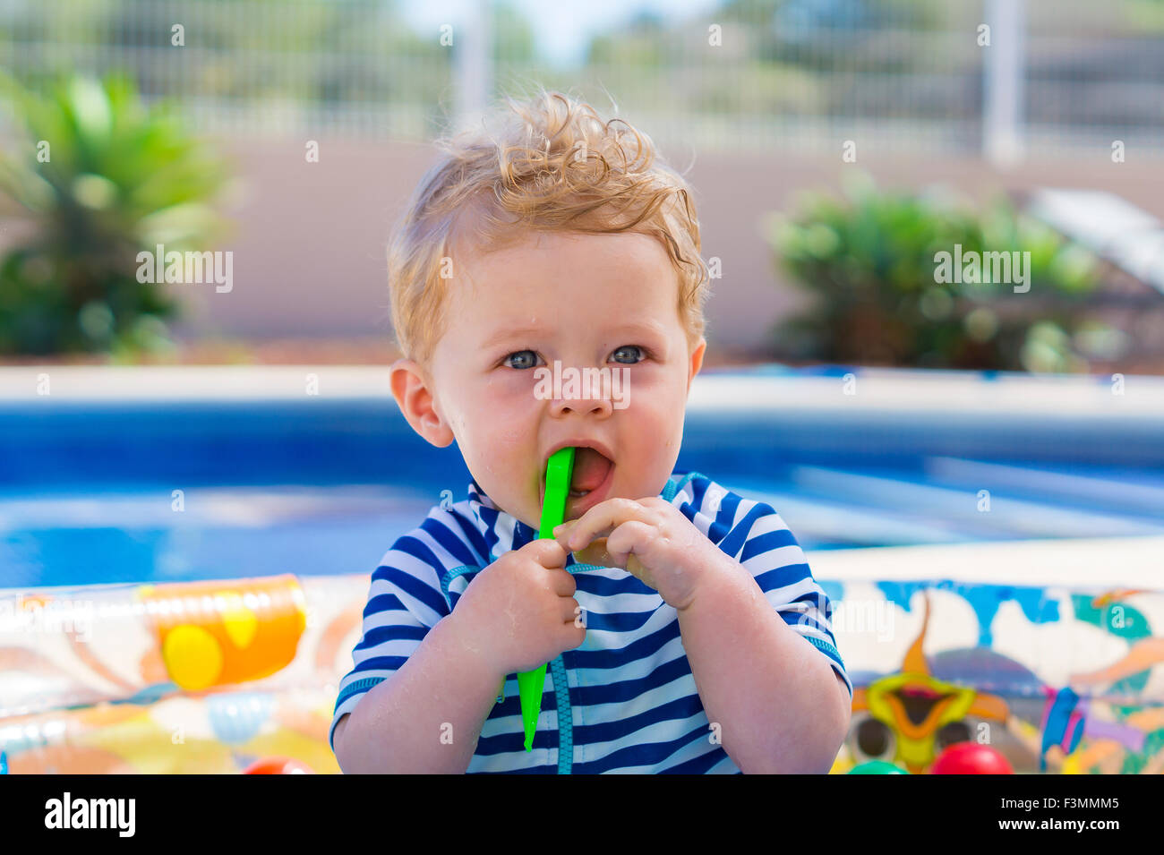 Cute baby boy in paddling pool on holiday Stock Photo Alamy