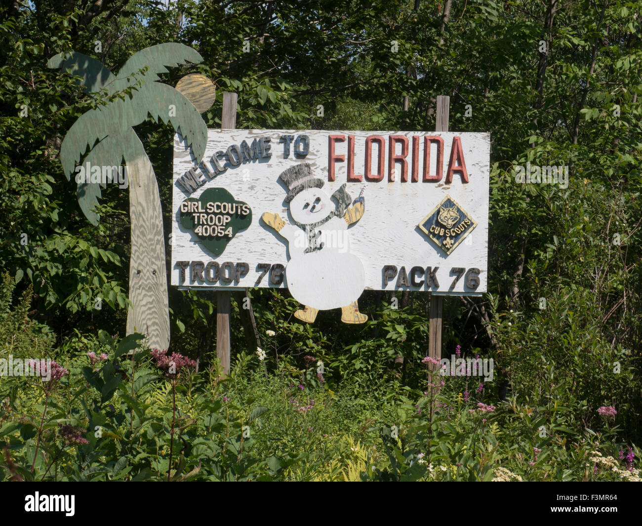 Florida, Massachusetts sign crafted by local scout troops, with the unusual combination of palm tree (none) and snow (lots). Stock Photo