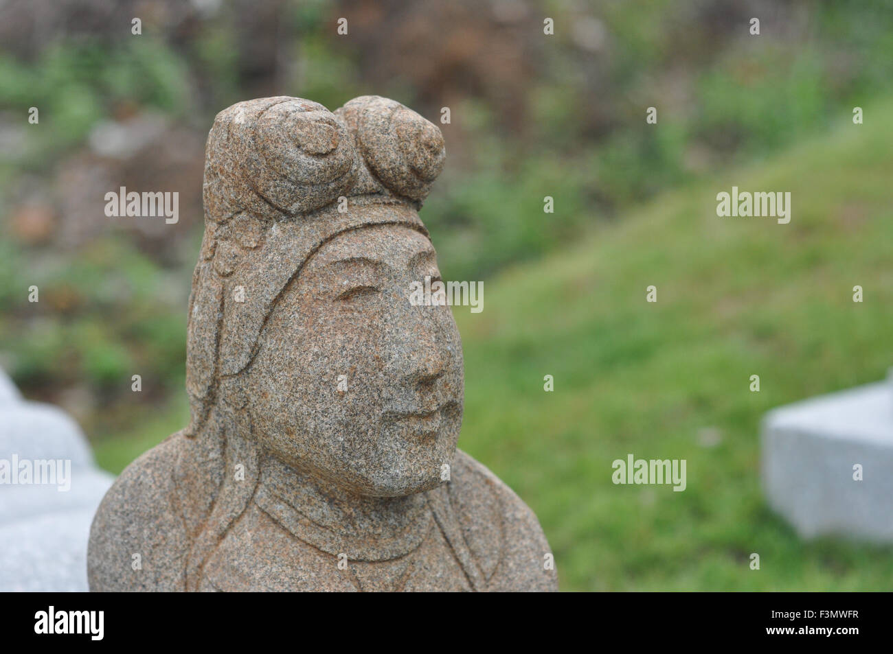 A statue on a Chinese grave in Batam, Indonesia Stock Photo
