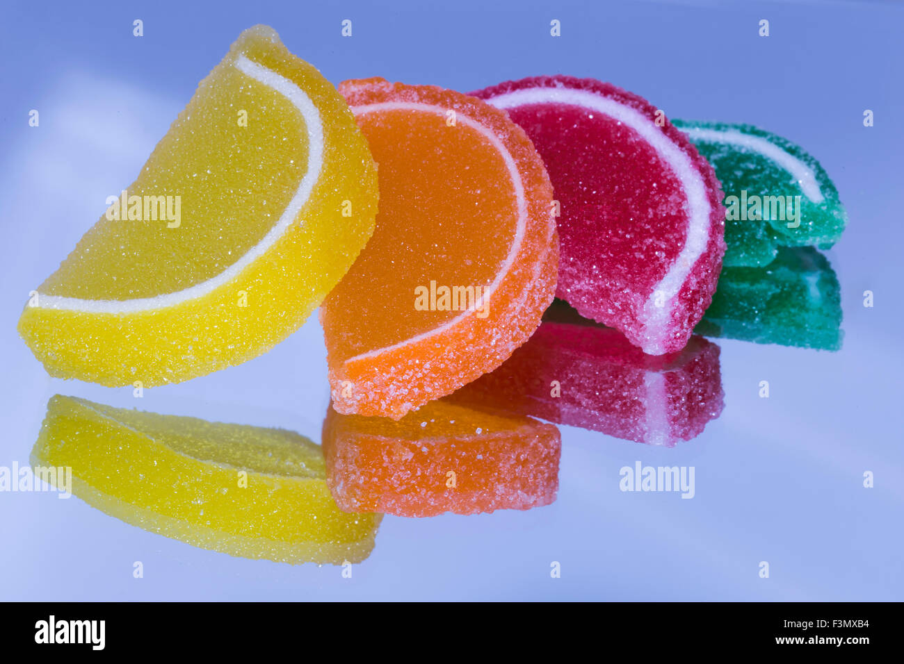Candied fruit slices on a mirror for reflection Stock Photo Alamy