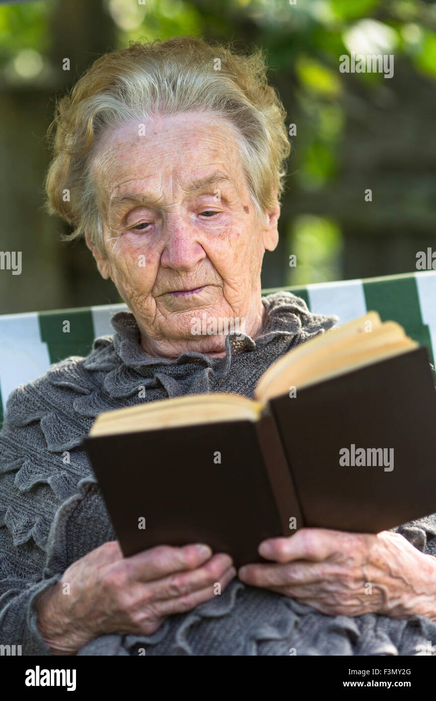 woman-reading-a-book-sitting-hi-res-stock-photography-and-images-alamy