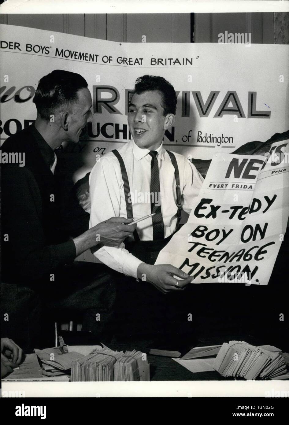 The Teddy. 24th Feb, 1962. Boy Crusader: Preparing for his First Meeting: Bob Couchman shows some of his posters and leaflets advertising his crusade and mission amongst London's Teddy Boy's, Mr. Clifford Tillett, a youth Club leader. © Keystone Pictures USA/ZUMAPRESS.com/Alamy Live News Stock Photo