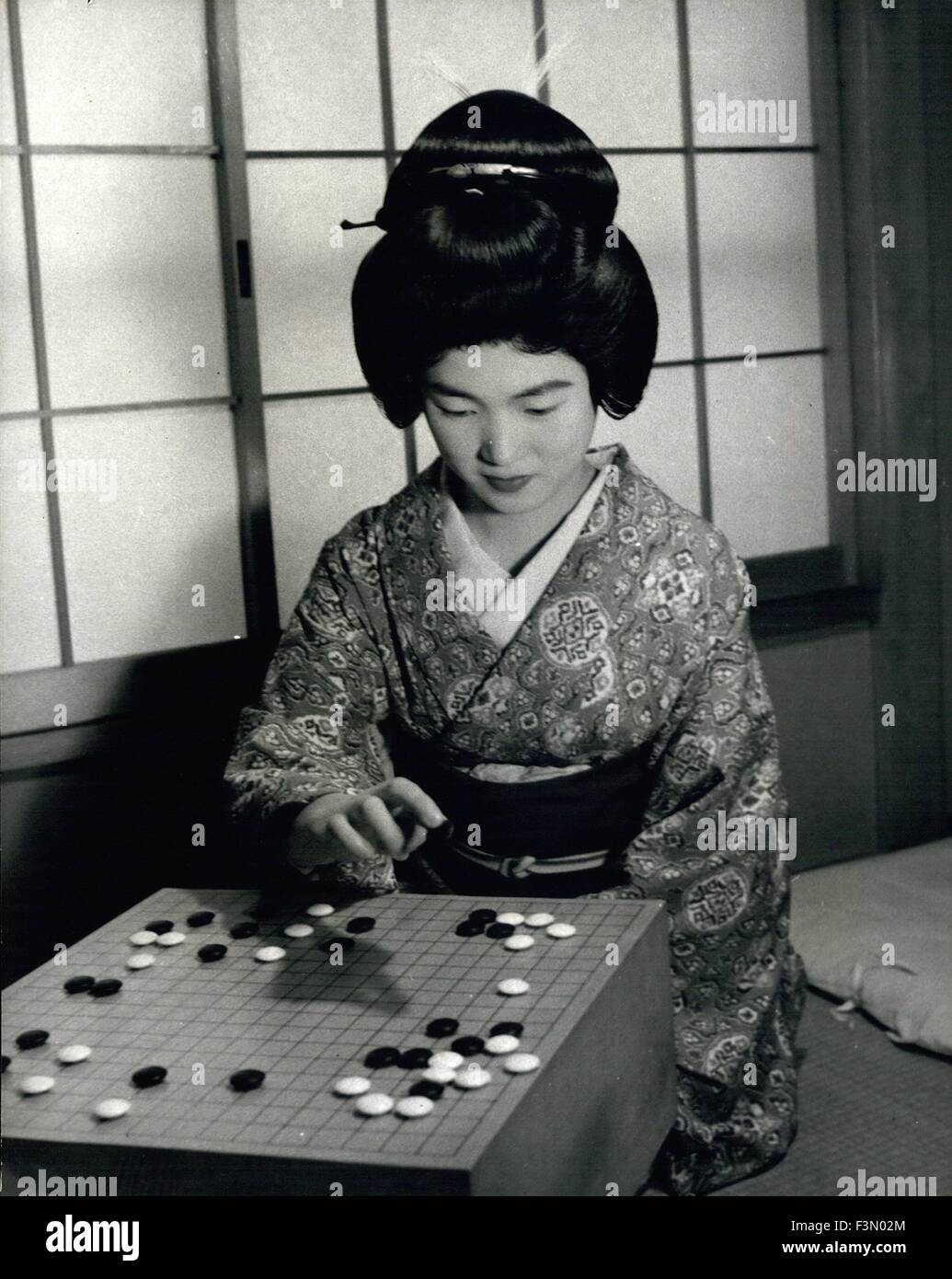 Feb. 24, 1962 - A geisha girl plays ''Go'' while off duty in her house ...