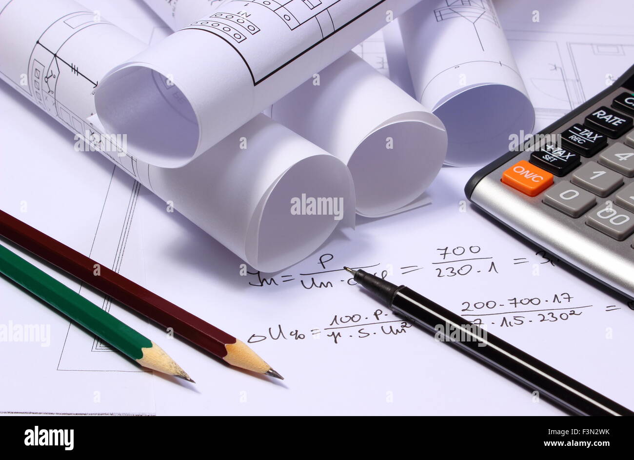 Rolls of electrical diagrams, calculator and mathematical calculations ...