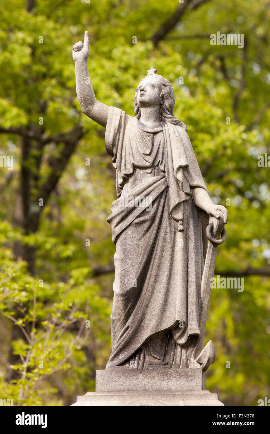 Statue Pointing Up Stock Photo