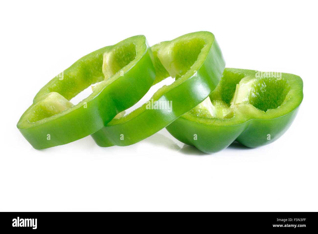 Sliced green pepper isolated on white background Stock Photo - Alamy