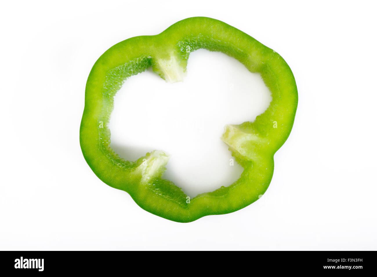 Sliced green pepper isolated on white background Stock Photo - Alamy