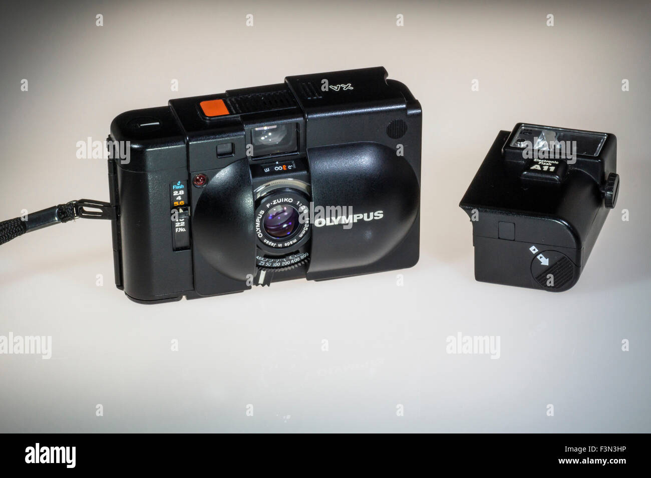 An Olympus XA 35mm film Rangefinder camera with A11 detachable flash. Designed by Yoshihisa Maitani Stock Photo