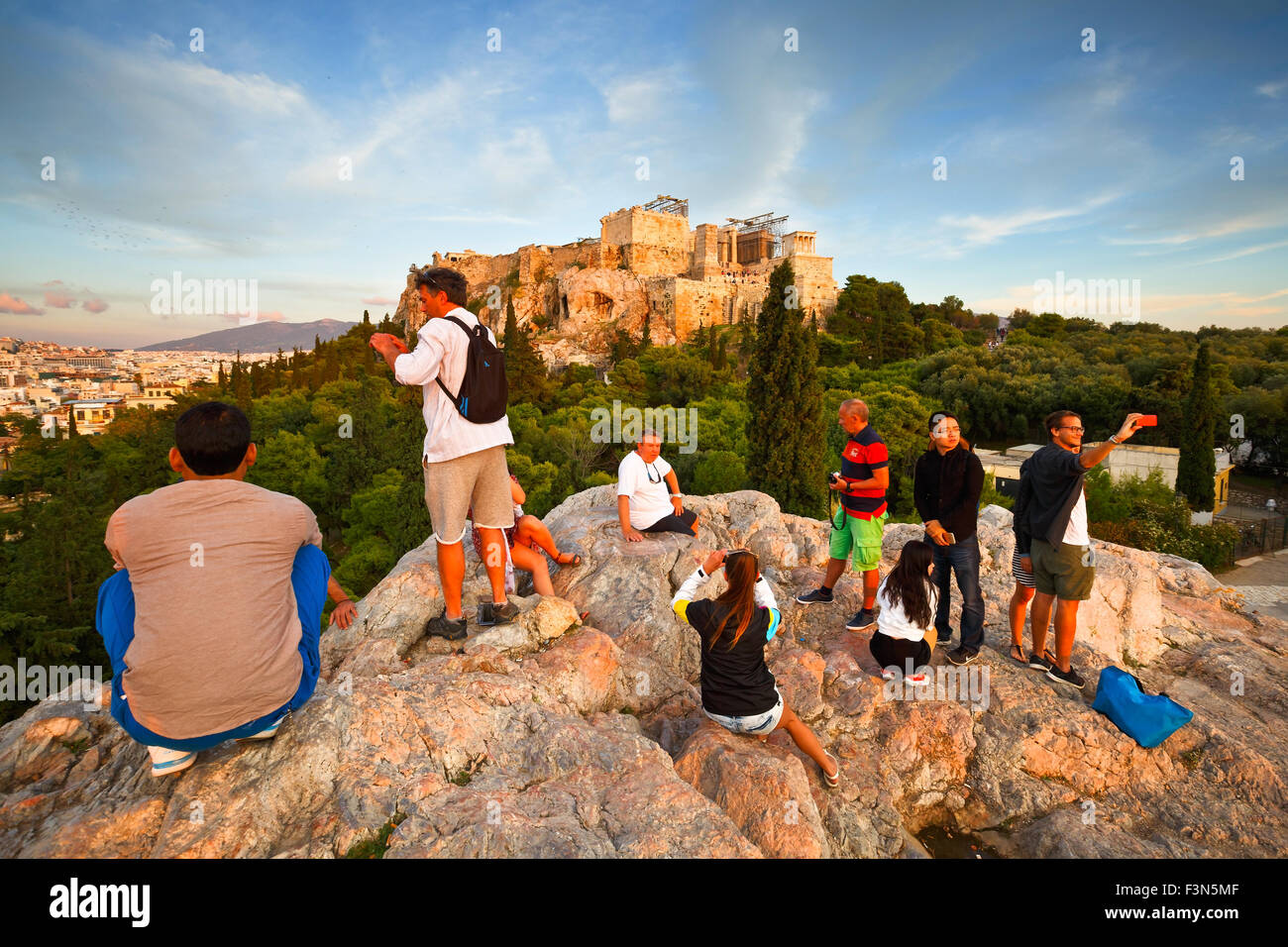 View of Acropolis from Areopagus hill with turists waiting for the sunset Stock Photo