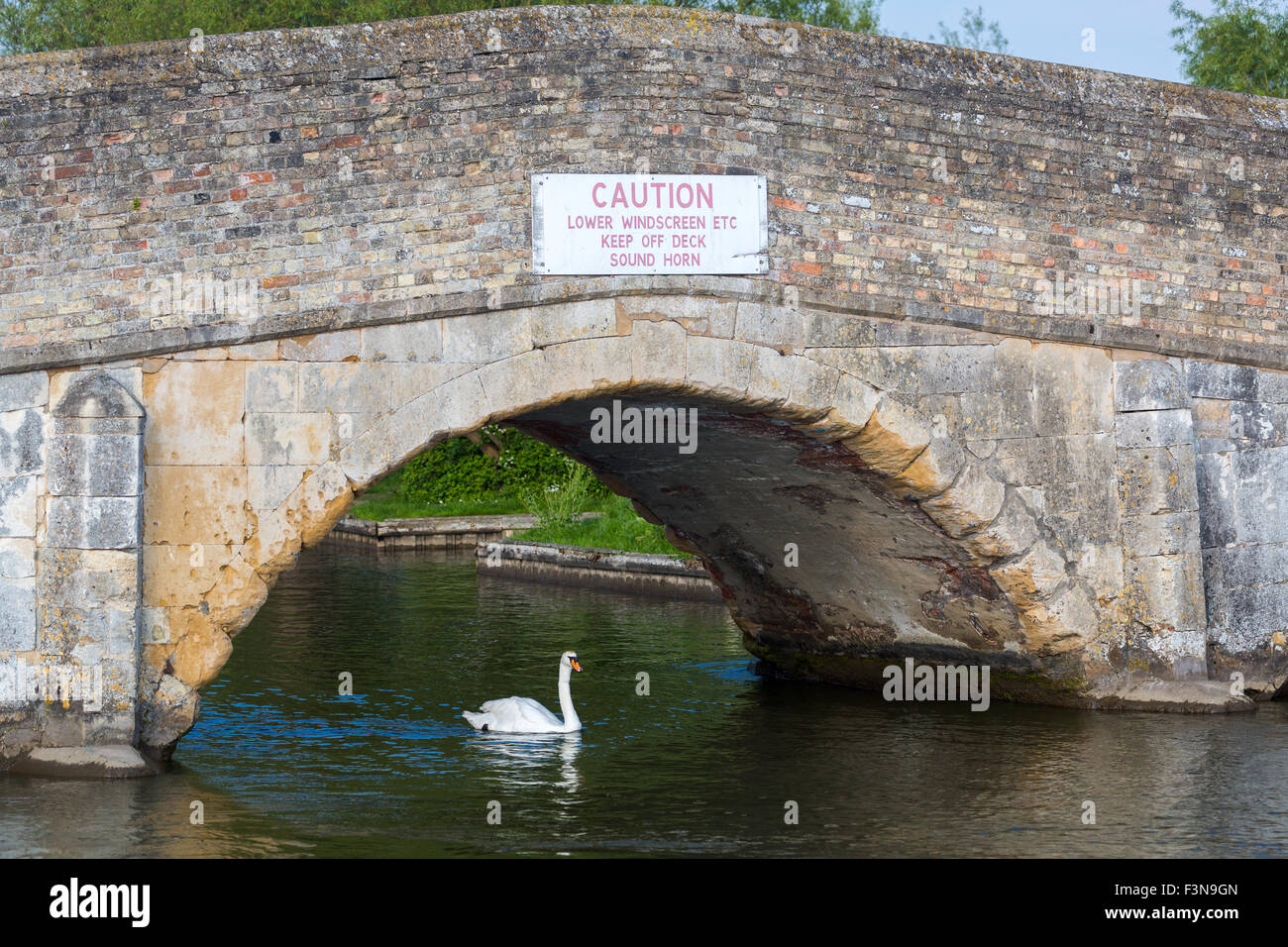 Very low medieval bridge at Potter Heigham. Norfolk Broads England UK