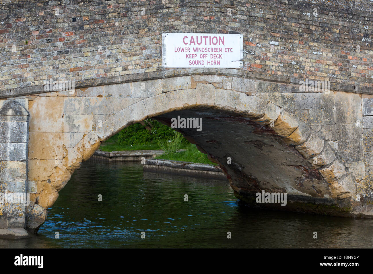 Very low medieval bridge at Potter Heigham. Norfolk Broads England UK
