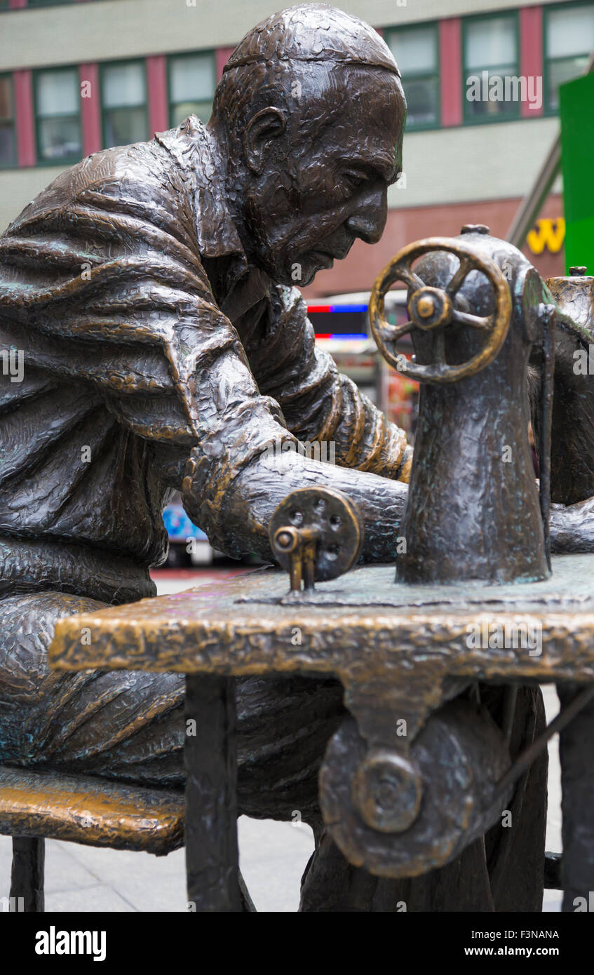 'The Garment Worker' statue on Seventh Avenue in the Fashion Walk of Fame, New York City, USA Stock Photo