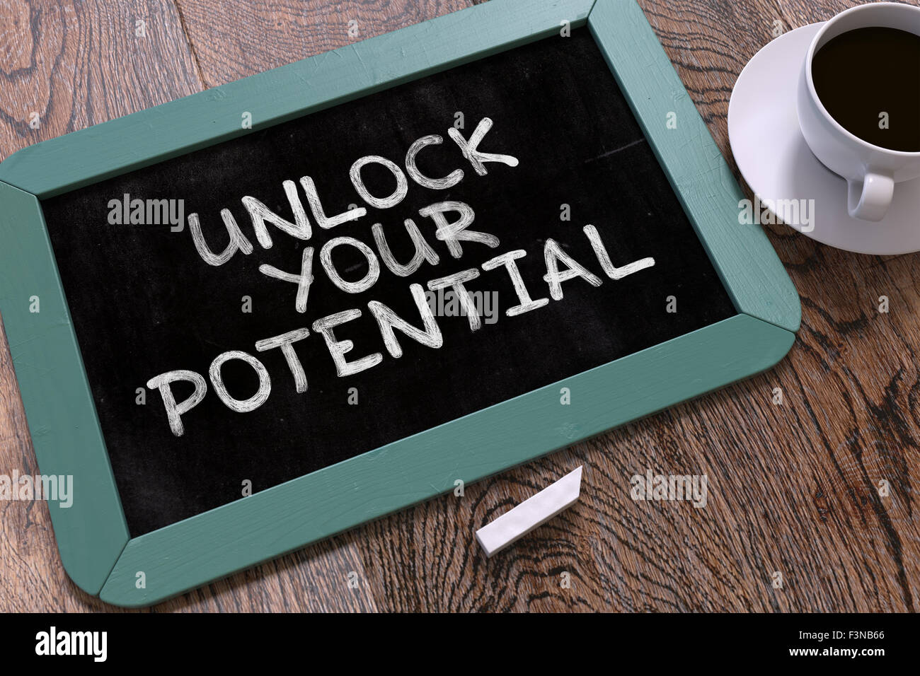 Hand Drawn Unlock Your Potential Concept on Chalkboard. Stock Photo
