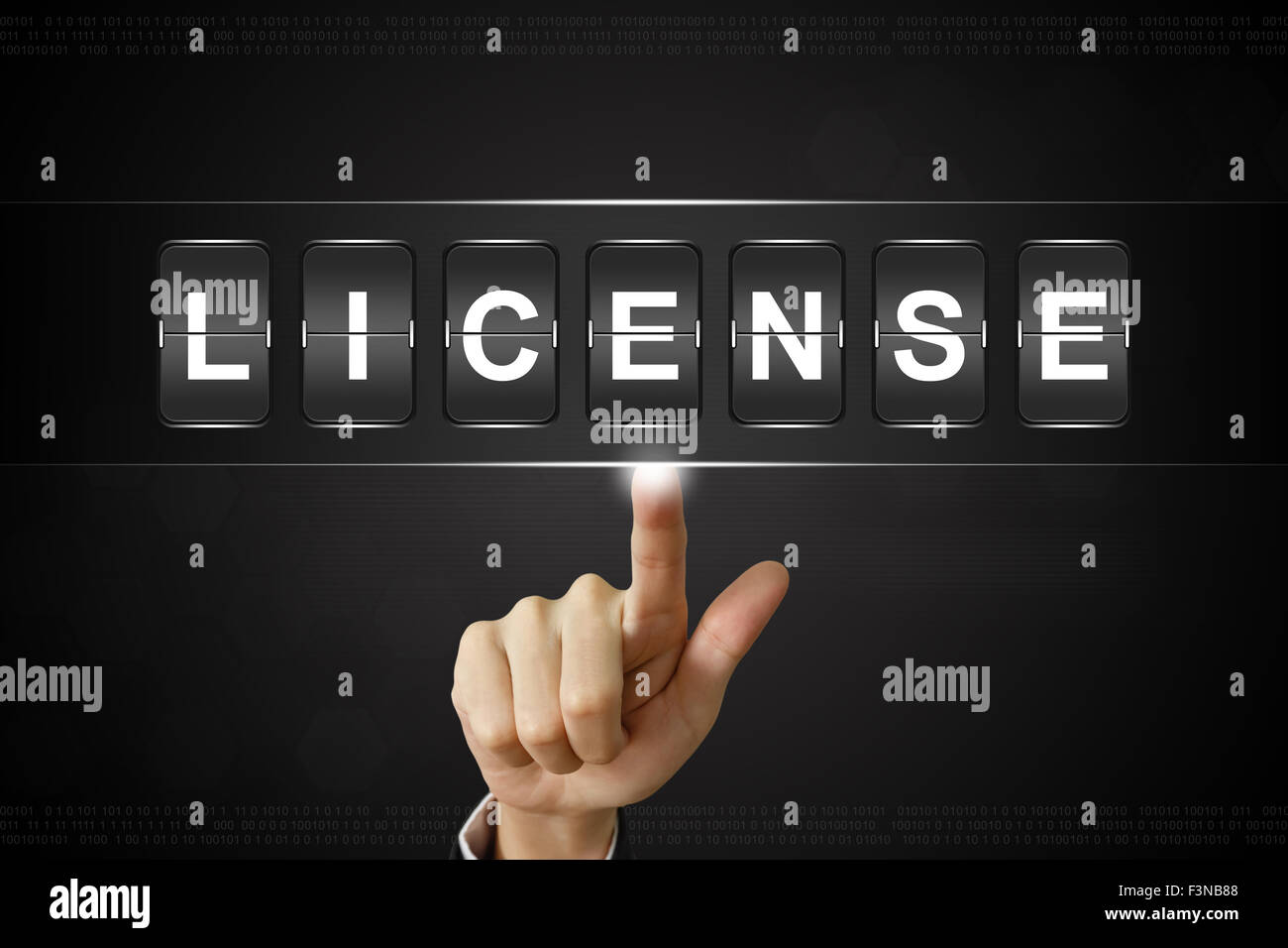 business hand pushing license on Flipboard Display Stock Photo