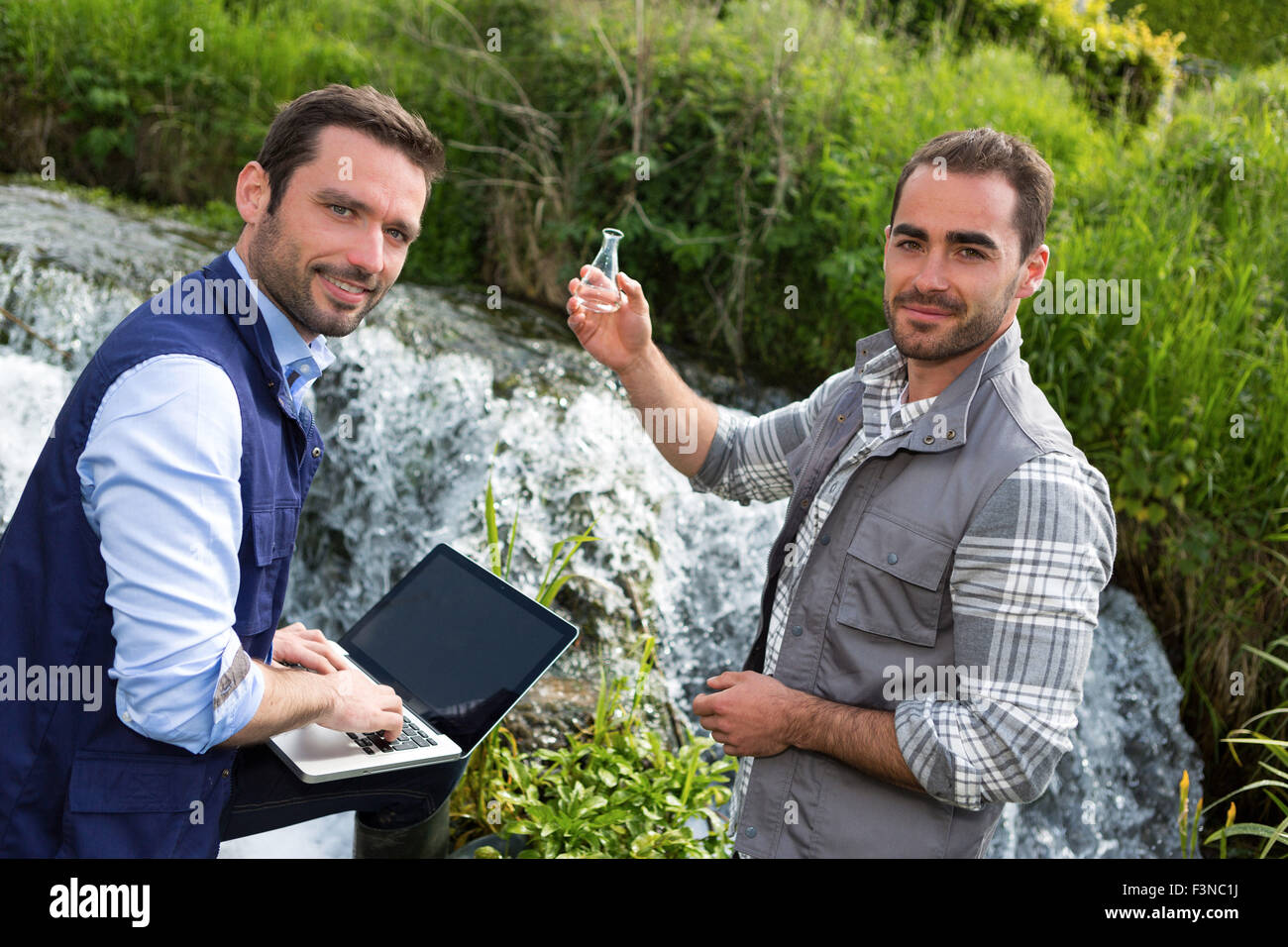 View of a Scientist and biologist working together on water analysis ...