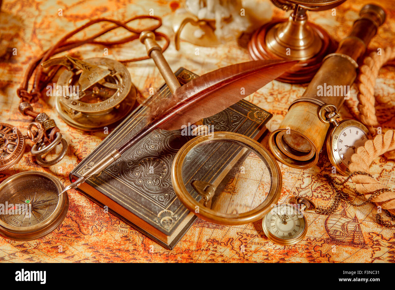 Vintage still life magnifying glass, pocket watch, old book and goose