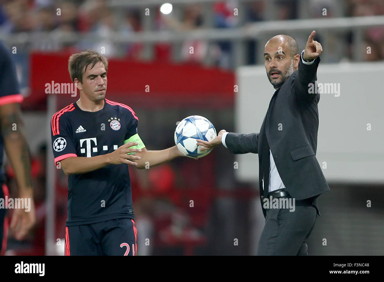 Athens, Greece- September 16, 2015: Philipp Lahm (L) taking the ball from Coach Josep Guardiola (R) during the UEFA Champions Le Stock Photo