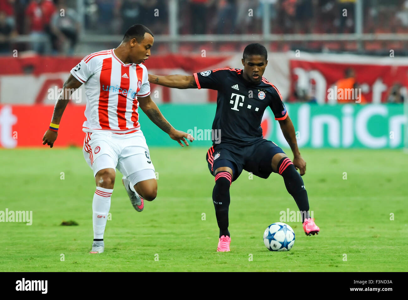 Athens, Greece- September 16, 2015: Douglas Costa (R) and Alfred Finnbogason (L) during the UEFA Champions League game between O Stock Photo