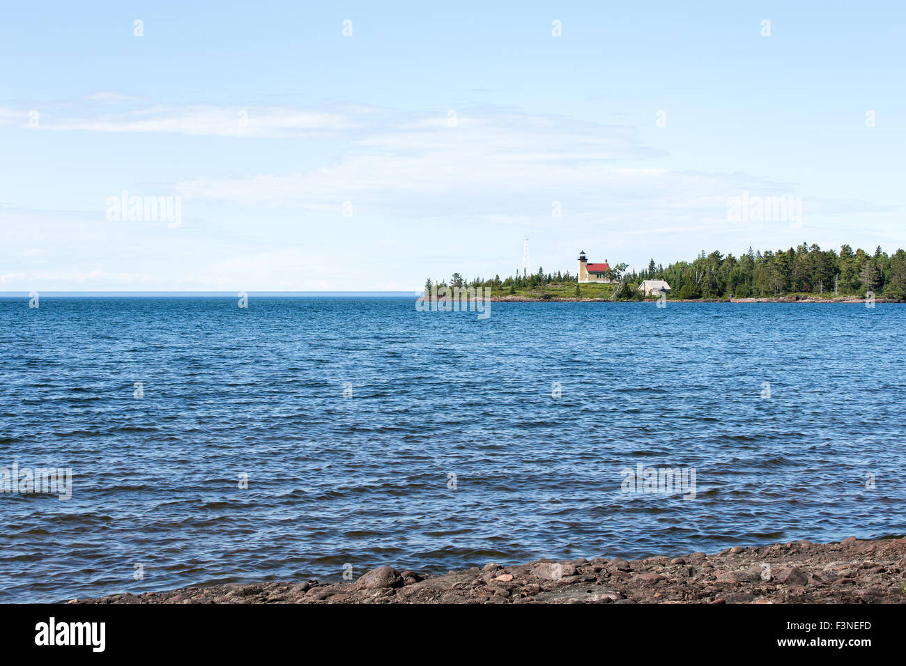 Lake Superior's Copper Harbor lighthouse. Red roof. Blue sky and water